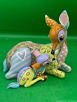 Front view of Bambi and Mother Britto figurine showing characters and glitter heart