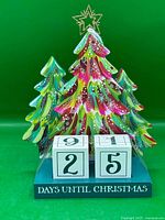 Front view showing multicolour trees, blocks, and countdown text