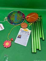 Complete unassembled wind chime with disk, wood pieces, chime tubes, tag