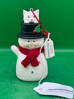 Front view of snowman ornament with cat in hat