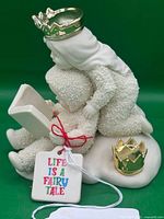 Front view of figurine showing two Snowbabies, crowns, and tag
