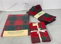 Packaged Home Collection tablecloth, bundled napkins, wrapped Alkaso tea towels