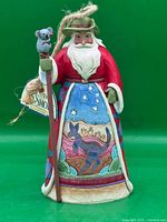 Front view of Jim Shore Australian Santa figurine with koala staff and kangaroo scene