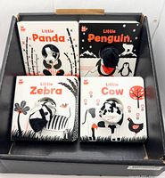 Overview of four finger puppet board books in box