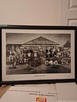 Full view of framed Pat's Garage monochrome print showing frame, glazing and content