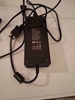 Top view of Xbox One power brick with cables visible