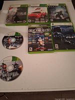 Overview of five cased Xbox 360 games and two loose Battlefield discs