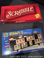 Scrabble and Rummy-O boxed games side by side, top view