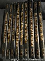 Spine view of nine black hardcovers with gold titles and Citadel Press imprint