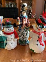 Group shot of three snowman figurines