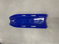 Top view of blue sled showing overall shape and pull rope