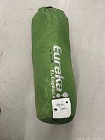 Tent packed in green stuff sack showing overall item