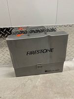 Front view of gray Firestone carry case