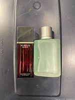 Both fragrance bottles standing side by side without boxes