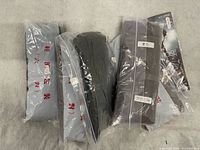 Front view showing five zip-bagged hosiery packages and one retail packaged MYLONG pantyhose