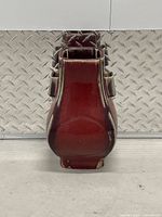 Front view of red glazed square vase showing full shape and handles
