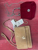 Overall view of both handbags showing size, color, straps and hardware