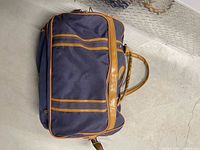 Top view of navy duffel showing overall design and condition