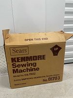 Cardboard box showing Sears Kenmore Sewing Machine, model 15B 17832, item no. 81783, made in Japan