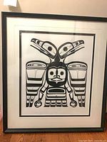 Full view of framed print under glass