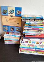 Overall view of two stacks of assorted children’s books