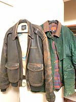 Front view of both jackets hanging side by side