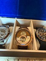 Three watches in box: Spinnaker left, Earnshaw center, Filippo Loreti right