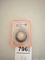 Full view of encapsulated 1908 Qing Dynasty silver coin in slab