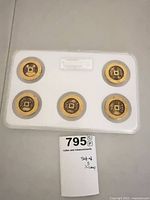 Top view of case showing five coins