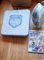 Seat cushion, football and portion of program