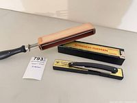 Paddle strop, straight razor, both boxes