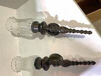 Two metal sconces with glass shades top view