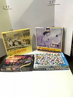 Four boxed puzzles lined up: Cats 550, Kodacolor cat, Volkswagen Beetles, Elvis