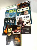 All seven publications laid out showing front covers