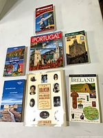 All seven travel guidebooks laid out