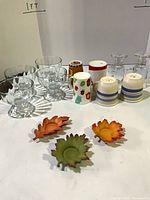 All items group shot: mugs, dessert dishes, leaf tealight holders