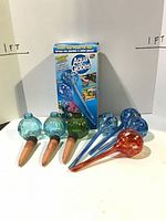 Six full-size and three small watering globes with retail box