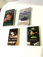 All four books laid out for overview