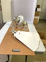 overview of disassembled ceiling fan parts on table