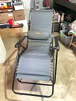 Chair fully extended showing sling, pillow, frame