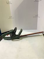 Full view of hedge trimmer showing blade and body