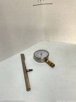 Gauge and probe laid flat showing overall condition