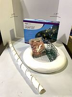 Boxed Aquascape light kit, suet feeder, foam ring, perforated tube, bag of bricks