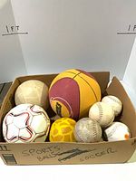 Box of assorted balls overall view