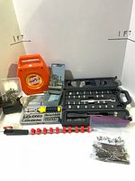 Group shot of all tool kits, cord reel, drill bits, screwdriver, socket rail and flexible extension