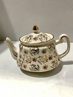 Right side view of cream floral Price Kensington teapot with lid on
