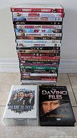 Full stack of DVD cases with Blue Bloods box and The DaVinci Files set