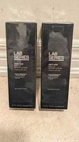 Two boxed Lab Series Anti-Age Max LS Water Lotions front view