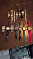 Group shot of all wristwatches laid out on table