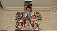 Group shot of all seven sealed VHS tapes